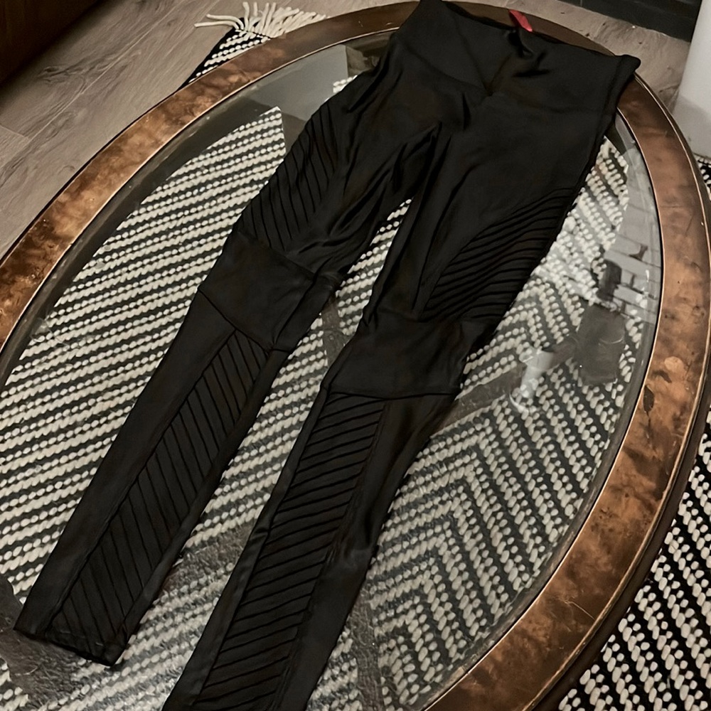 Moto black faux leather leggings! Never worn, sleek!! Get your hot pants